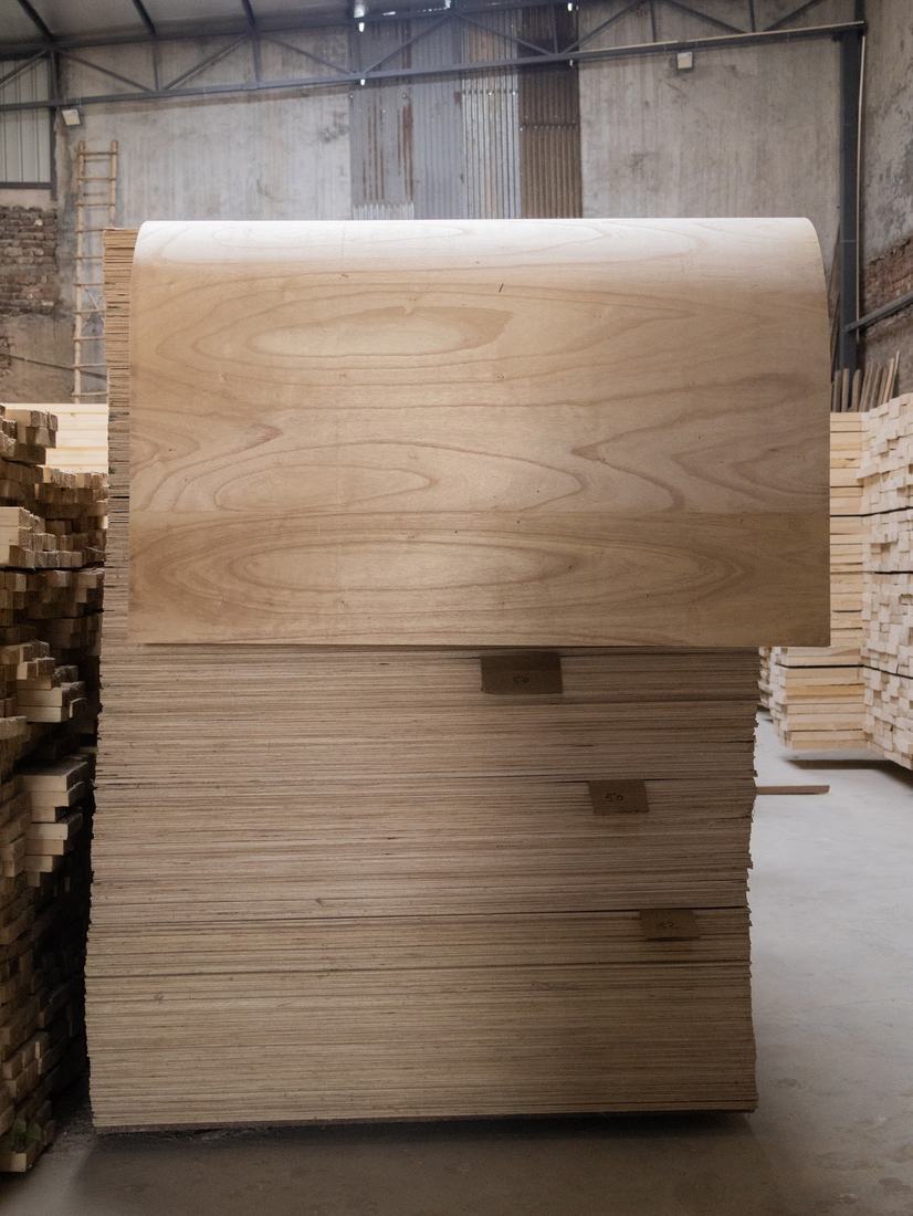 Flexi ply sheet curving over plywood stack