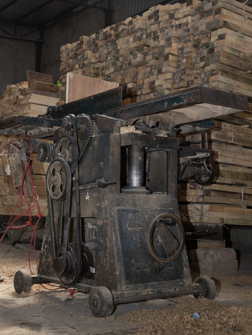 Planer machine with timber behind