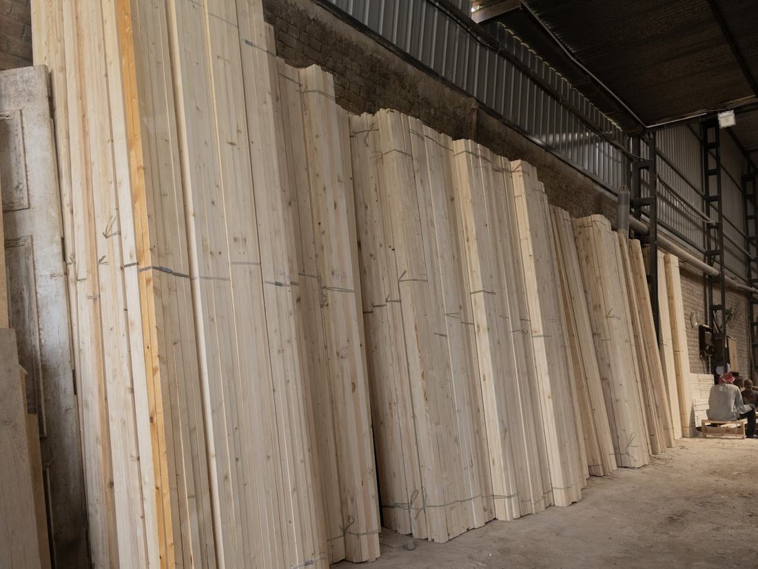 Pine planks stacked upright