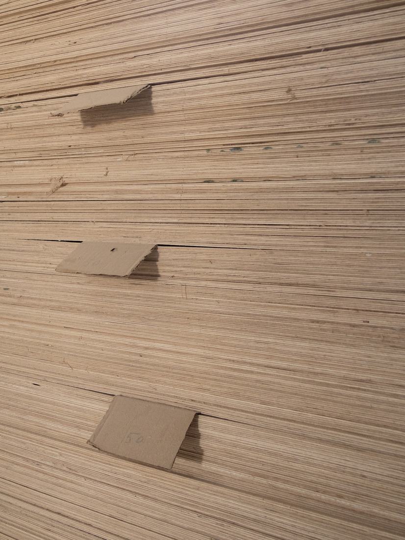 Edges of stacked plywood sheets